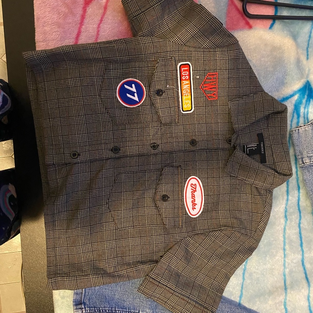 A crop top with five patches.